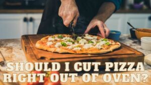 Should i cut pizza right out of Oven?